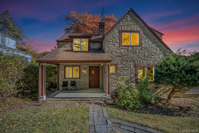 a front view of a house with yard
