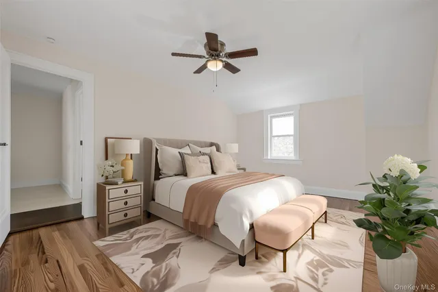 a bedroom with a bed and window