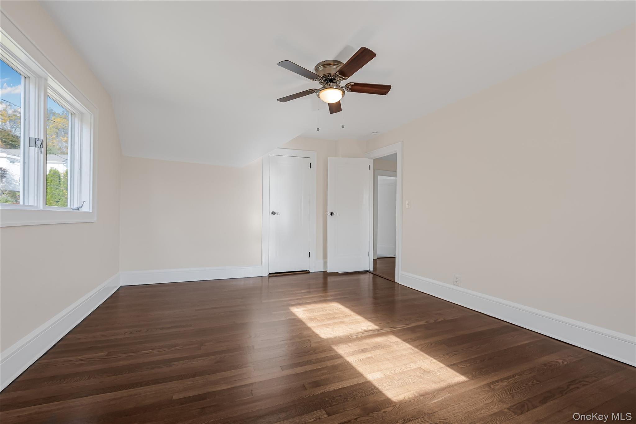 39 Hillcrest Road Hartsdale, NY 10530 - Photo 23 of 42 a view of empty room with wooden floor and ceiling fan