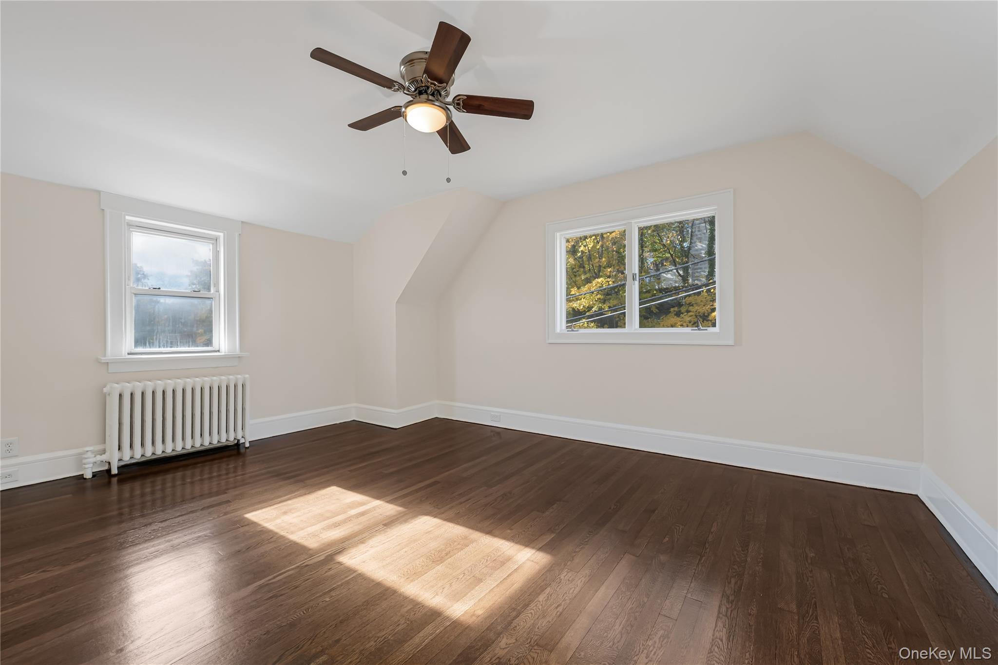 39 Hillcrest Road Hartsdale, NY 10530 - Photo 27 of 42 a view of empty room with wooden floor and fan