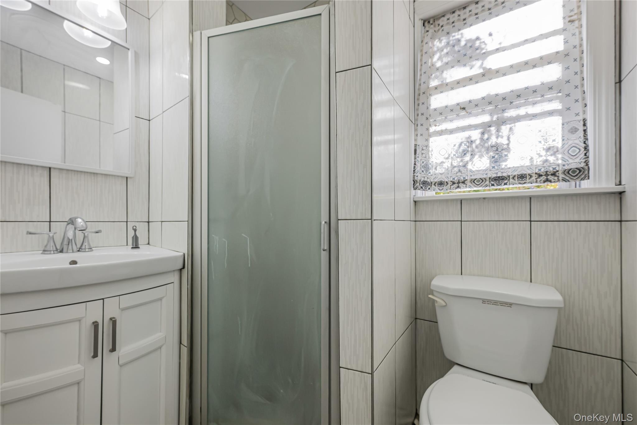 39 Hillcrest Road Hartsdale, NY 10530 - Photo 36 of 42 a white toilet sitting next to a bathroom sink