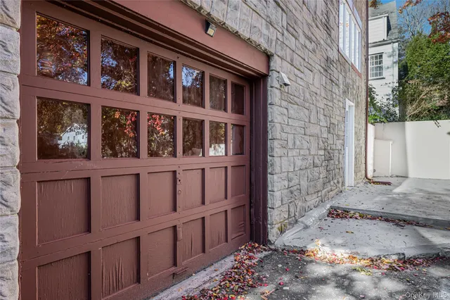 a view of a brick house with a large window