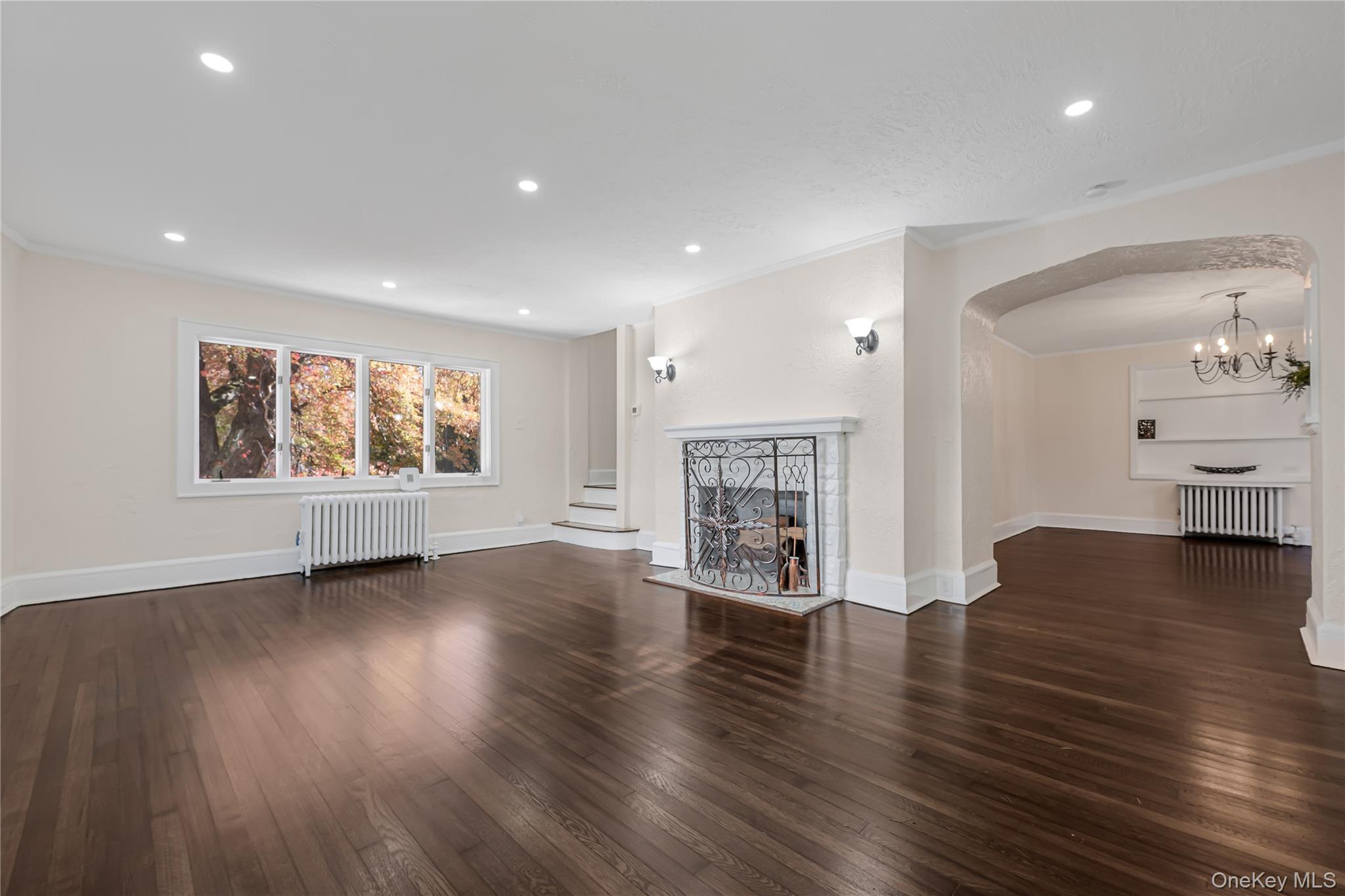 39 Hillcrest Road Hartsdale, NY 10530 - Photo 5 of 42 a view of an empty room with wooden floor and a window