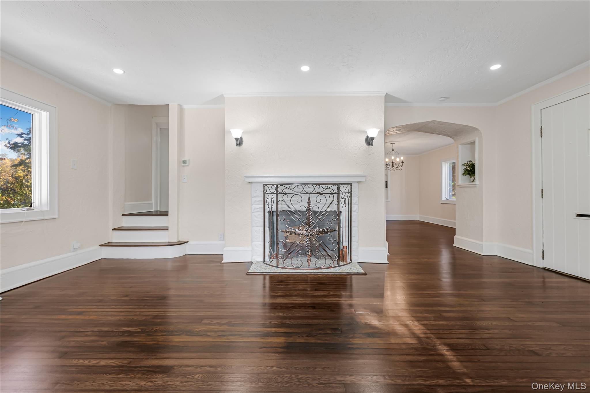 39 Hillcrest Road Hartsdale, NY 10530 - Photo 6 of 42 a view of an empty room with wooden floor and a window
