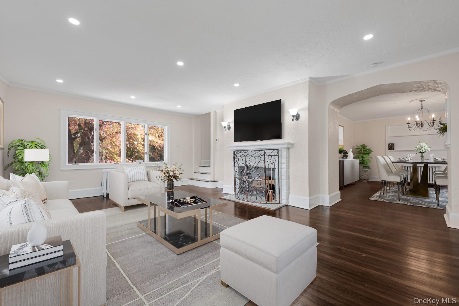 39 Hillcrest Road Hartsdale, NY 10530 - Photo 7 of 42 a living room with fireplace furniture and a flat screen tv