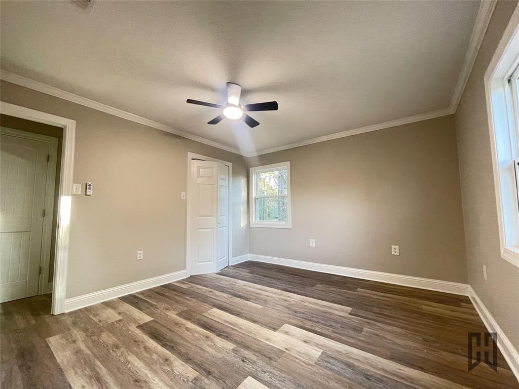 183 Beech Springs Road Minden, LA 71055 - Photo 11 of 28 a view of empty room with wooden floor and fan