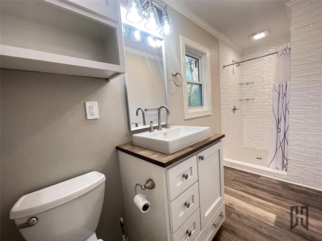 183 Beech Springs Road Minden, LA 71055 - Photo 12 of 28 a bathroom with a sink toilet and shower