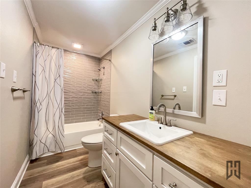 183 Beech Springs Road Minden, LA 71055 - Photo 16 of 28 a bathroom with a sink a toilet and shower
