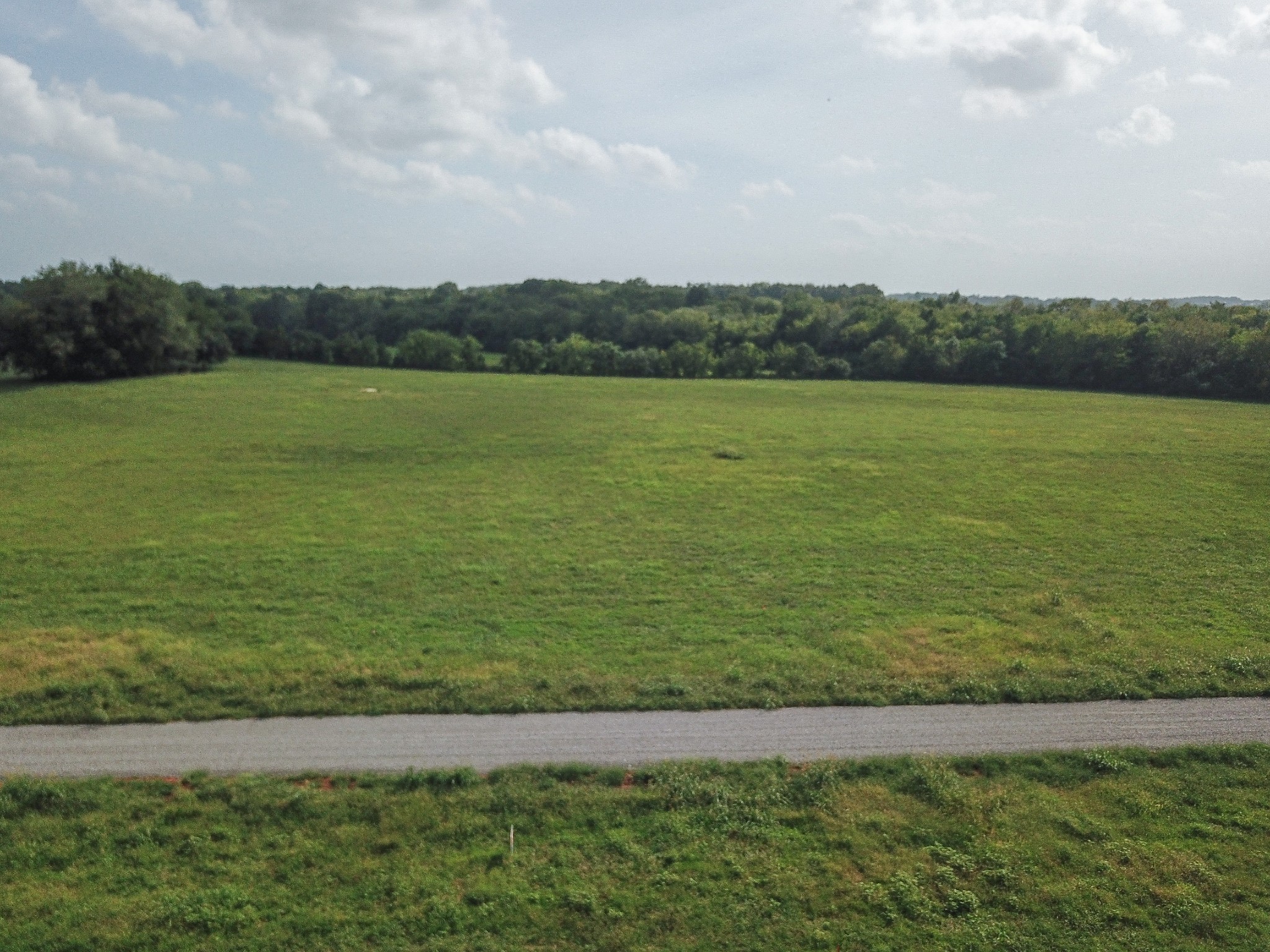 9687 Midland Road Bell Buckle, TN 37020 - Photo 2 of 5 a view of a lake with houses in the background