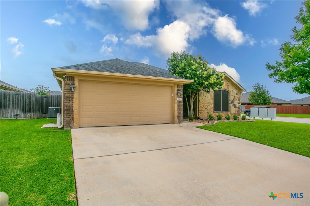 8304 Split Trl Cove Temple, TX 76502 - Photo 21 of 28 a front view of house with yard and green space