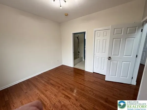 a kitchen with a refrigerator stove and cabinets