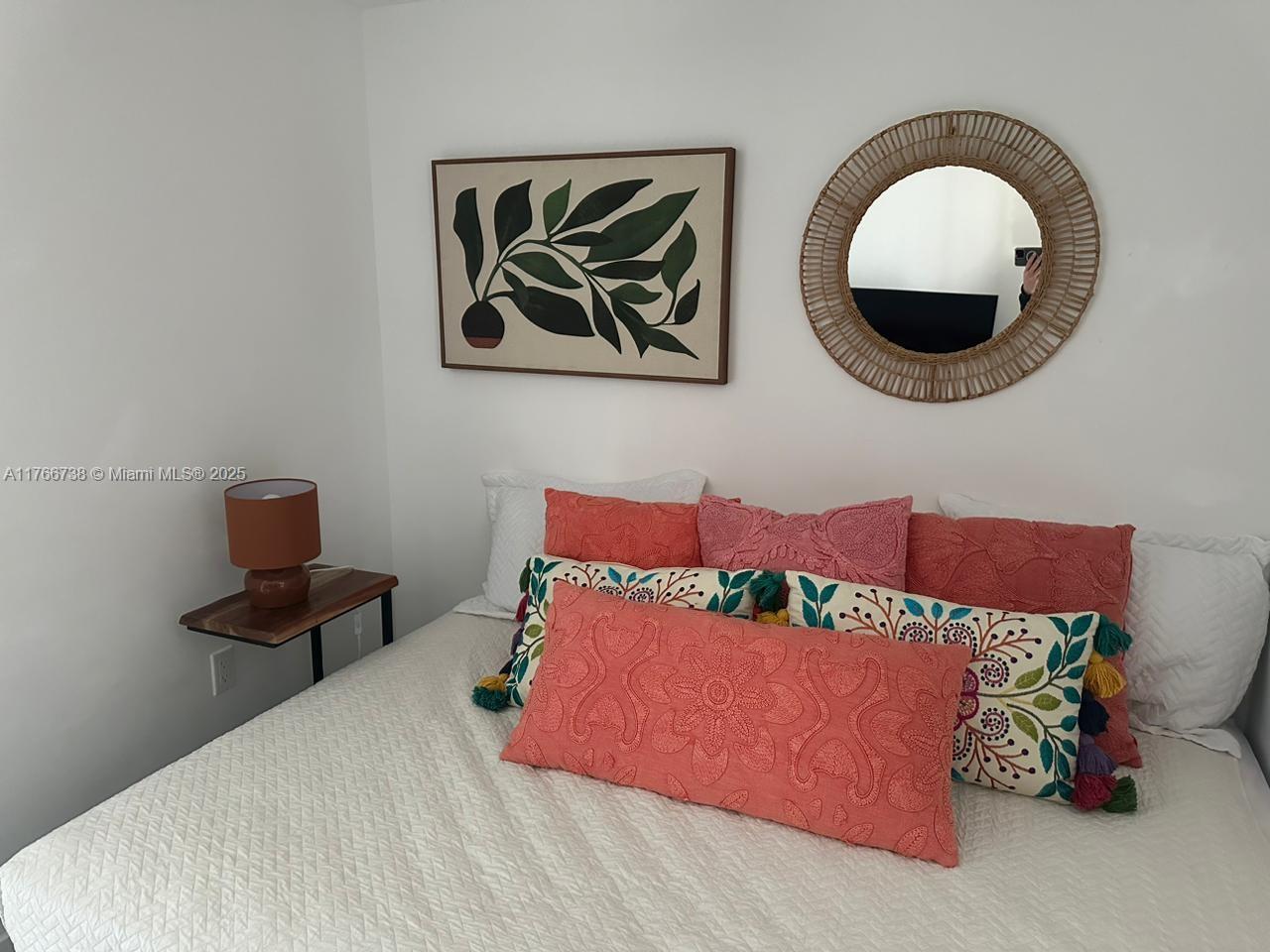 31 Southeast 6th Street, Unit 1601 Miami, FL 33131 - Photo 9 of 14 a bed room with a bed and a painting on the wall