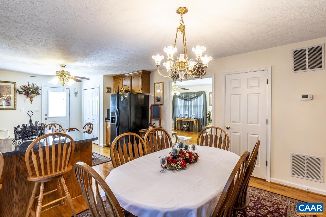 671 Chapel Road Ruckersville, VA 22968 - Photo 8 of 43 a view of a dining room with furniture