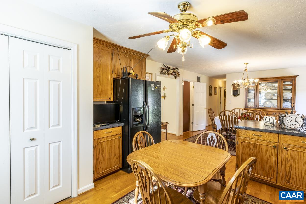 671 Chapel Road Ruckersville, VA 22968 - Photo 10 of 43 a view of a dining room with furniture window and wooden floor