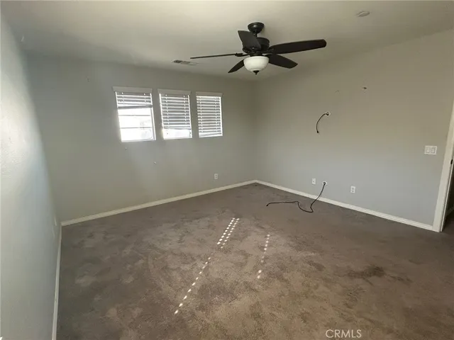 a view of hallway with sink and mirror