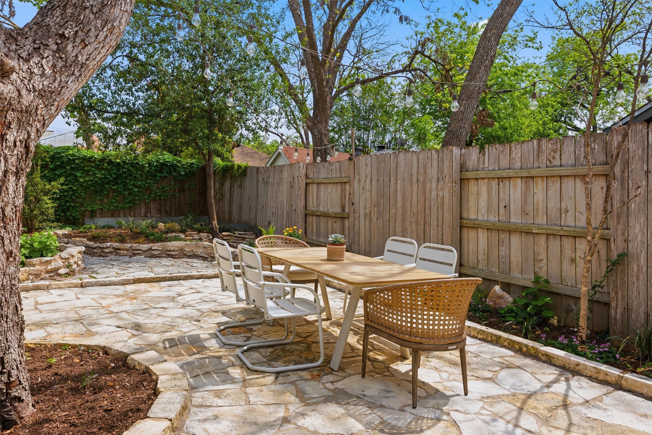 1507 Wethersfield Road Austin, TX 78703 - Photo 36 of 40 a view of a dinning table and chairs in backyard of the house
