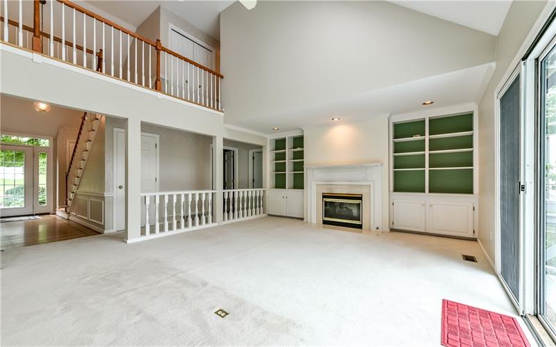 250 Sweet Gum Road Pittsburgh, PA 15238 - Photo 5 of 24 Great room with 2 sided fireplace, sliding door to the large deck. Balcony.
