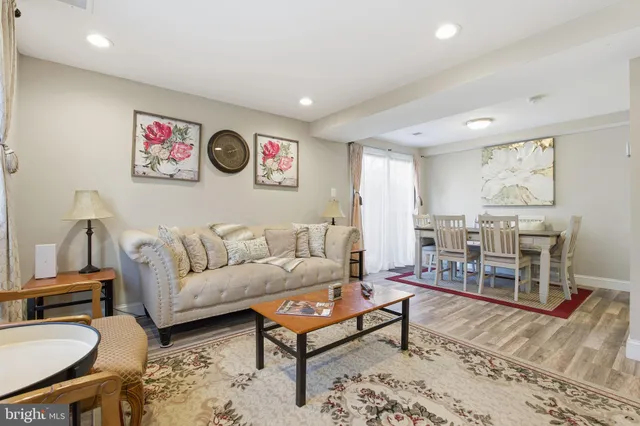 a living room with furniture and a rug