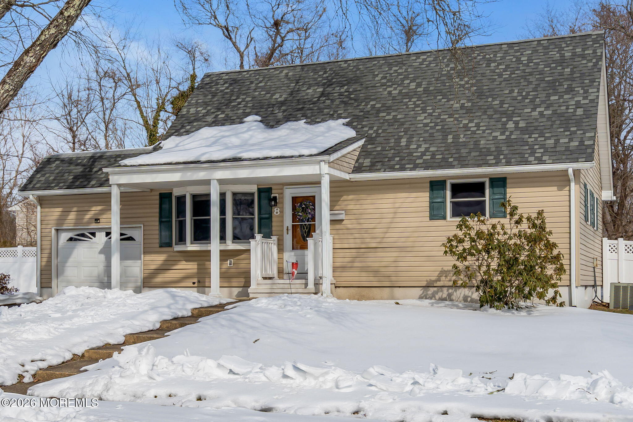 8 Trinity Place Jackson, NJ 08527 - Photo 37 of 45 a front view of a house with a yard and garage
