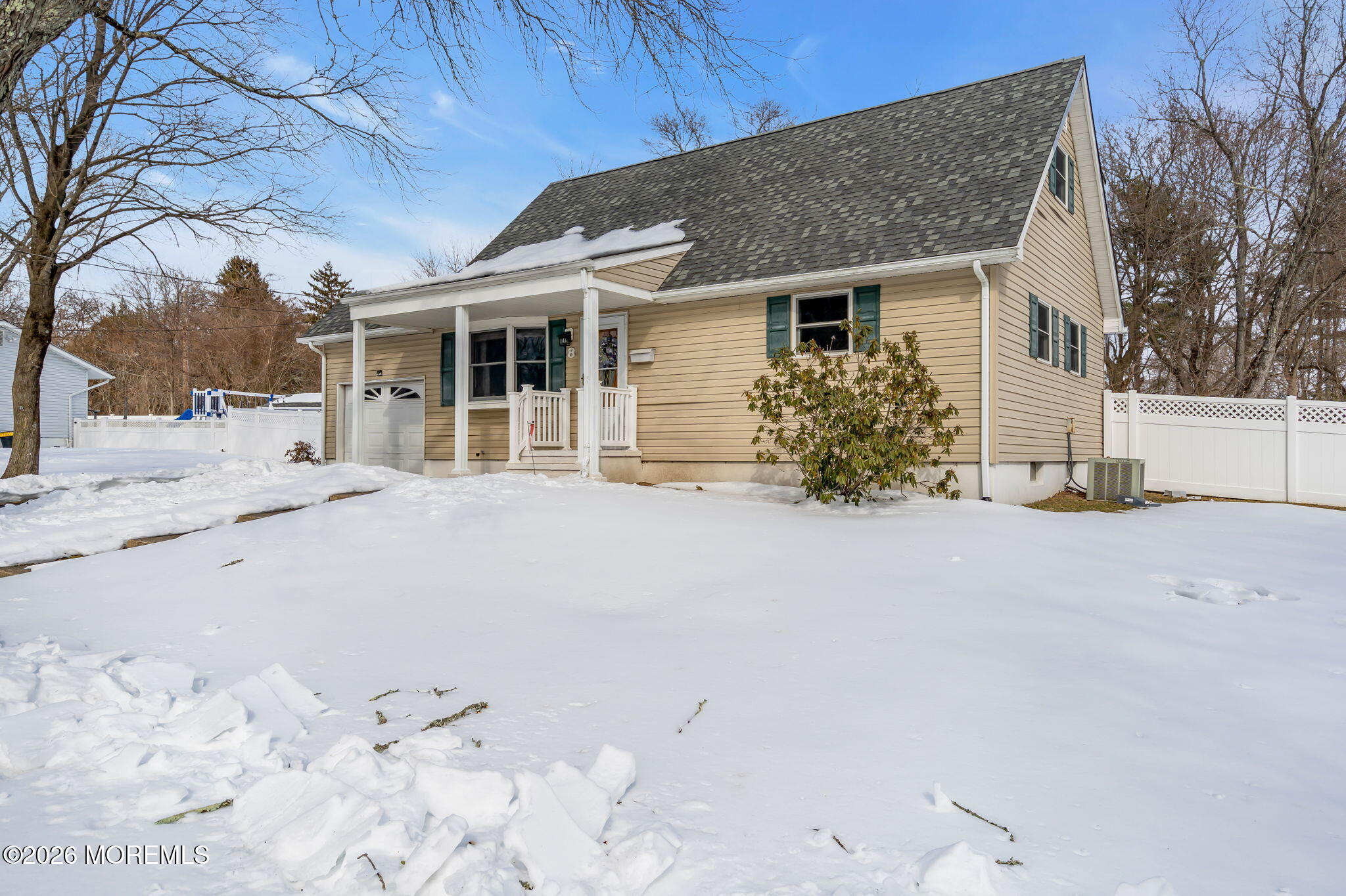 8 Trinity Place Jackson, NJ 08527 - Photo 39 of 45 a front view of a house with a yard covered in snow