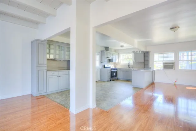 a kitchen with stainless steel appliances granite countertop a sink and cabinets