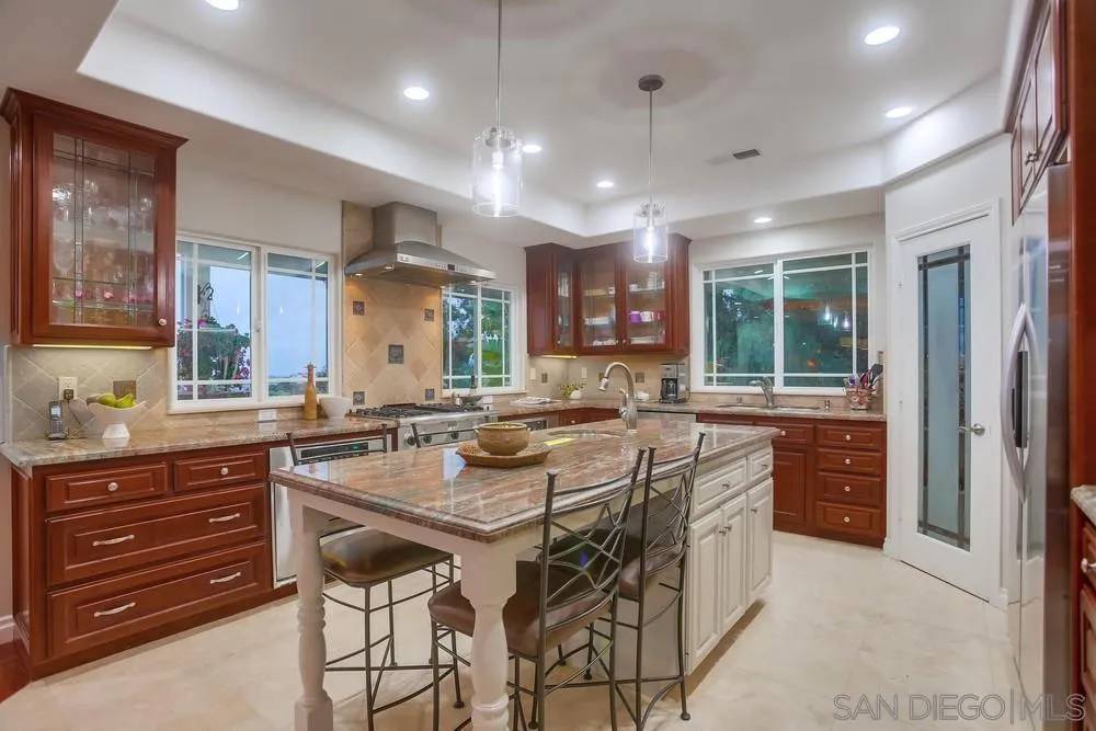 2234 Ivy Road Oceanside, CA 92054 - Photo 13 of 29 a kitchen with lots of counter space and windows