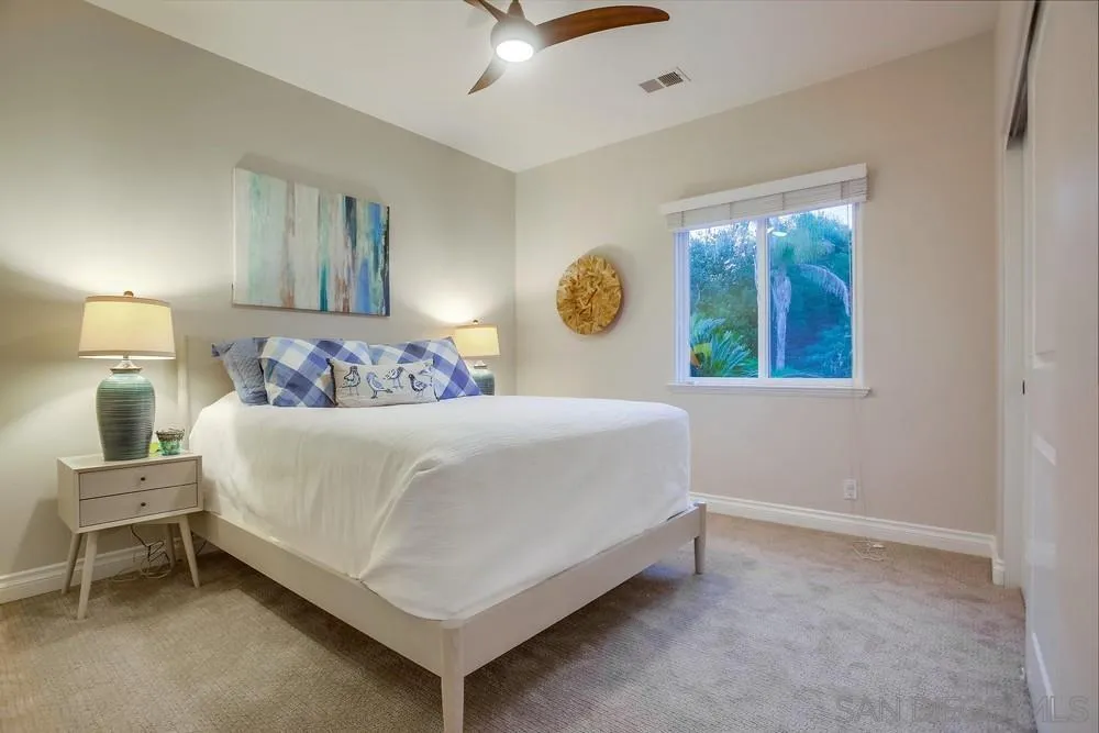 2234 Ivy Road Oceanside, CA 92054 - Photo 15 of 29 a bedroom with a bed and a painting on the wall