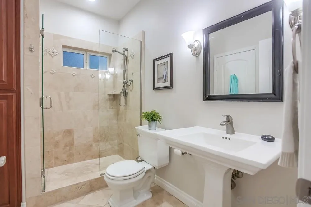 2234 Ivy Road Oceanside, CA 92054 - Photo 16 of 29 a bathroom with a sink toilet and shower