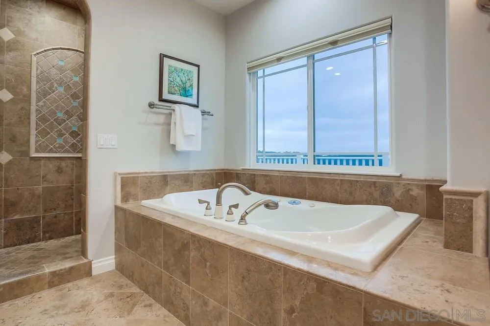 2234 Ivy Road Oceanside, CA 92054 - Photo 20 of 29 a bath tub sitting next to a white sink