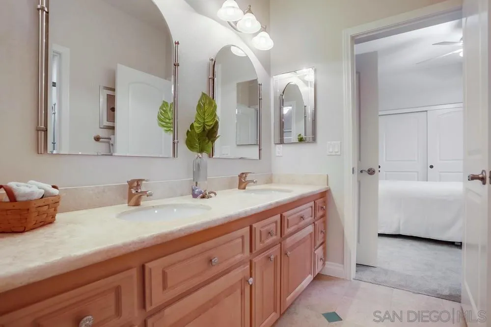 2234 Ivy Road Oceanside, CA 92054 - Photo 25 of 29 a bathroom with a double vanity sink mirror and bathtub