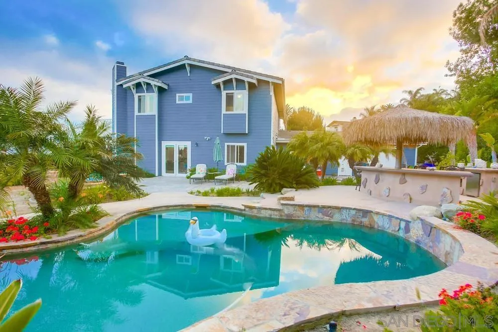 2234 Ivy Road Oceanside, CA 92054 - Photo 3 of 29 a front view of a house with swimming pool having outdoor seating