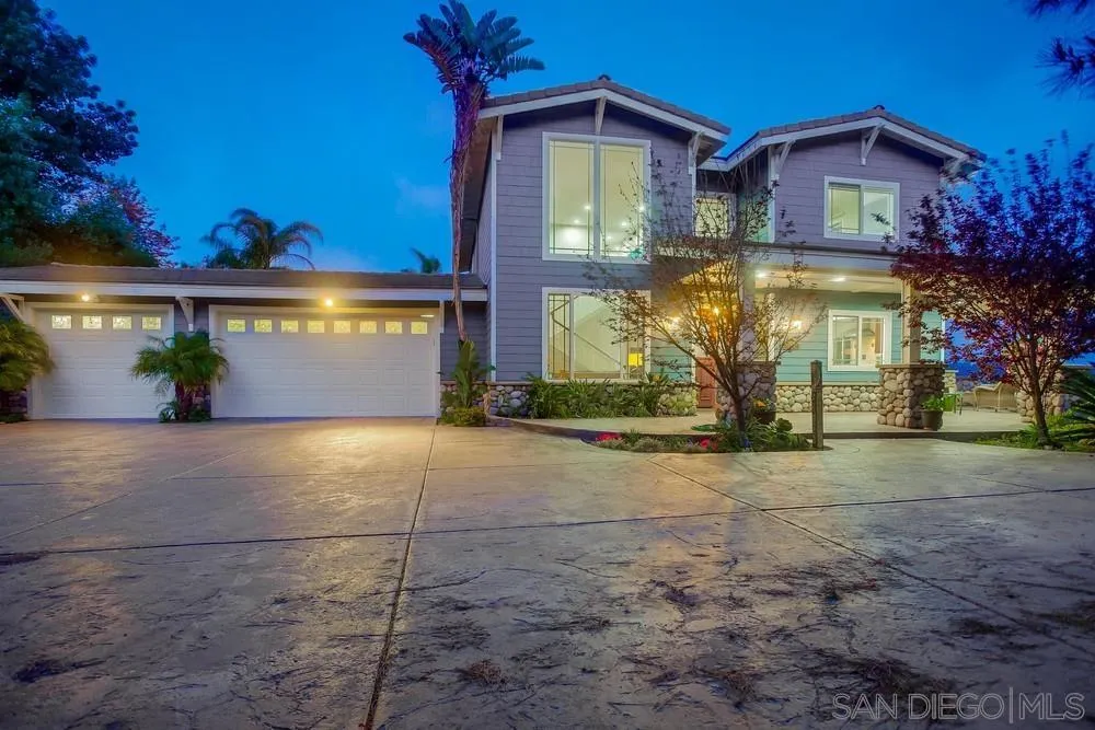 2234 Ivy Road Oceanside, CA 92054 - Photo 5 of 29 a front view of a house with a yard and garage