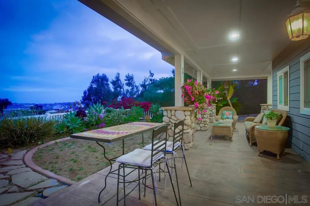 2234 Ivy Road Oceanside, CA 92054 - Photo 8 of 29 a view of a chairs and table in backyard