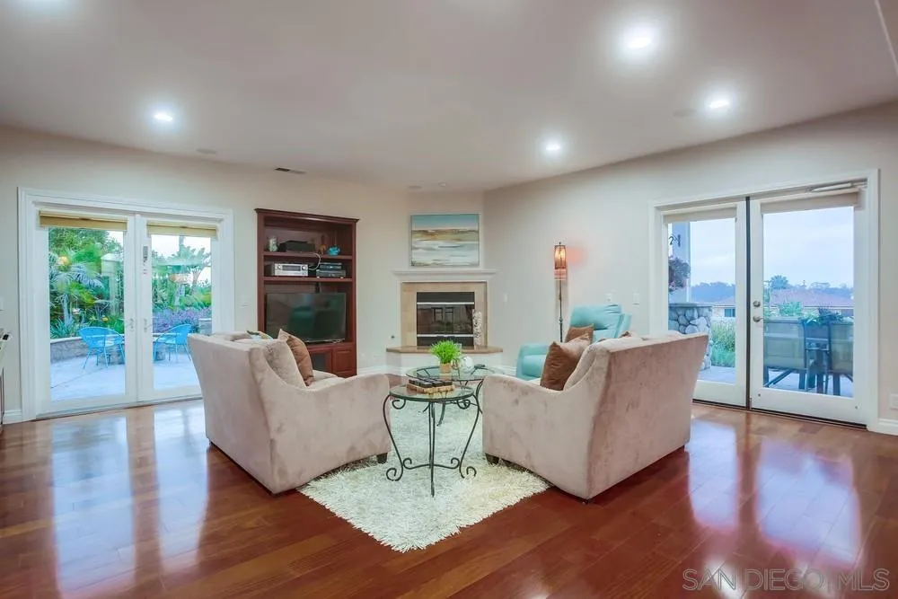 2234 Ivy Road Oceanside, CA 92054 - Photo 10 of 29 a living room with furniture and a wooden floor