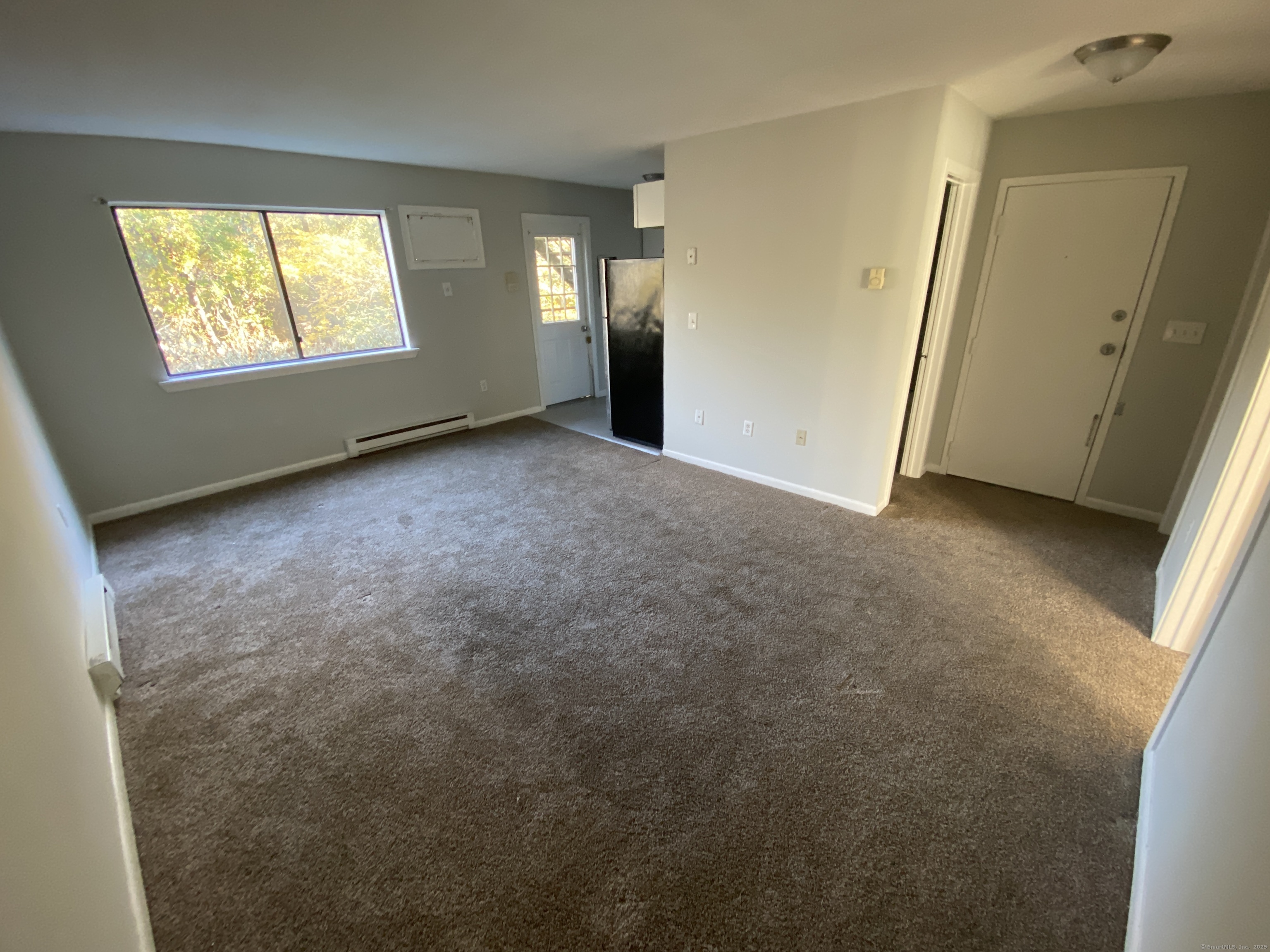 32 Old Foxon Road, Unit 27 East Haven, CT 06513 - Photo 6 of 6 an empty room with windows
