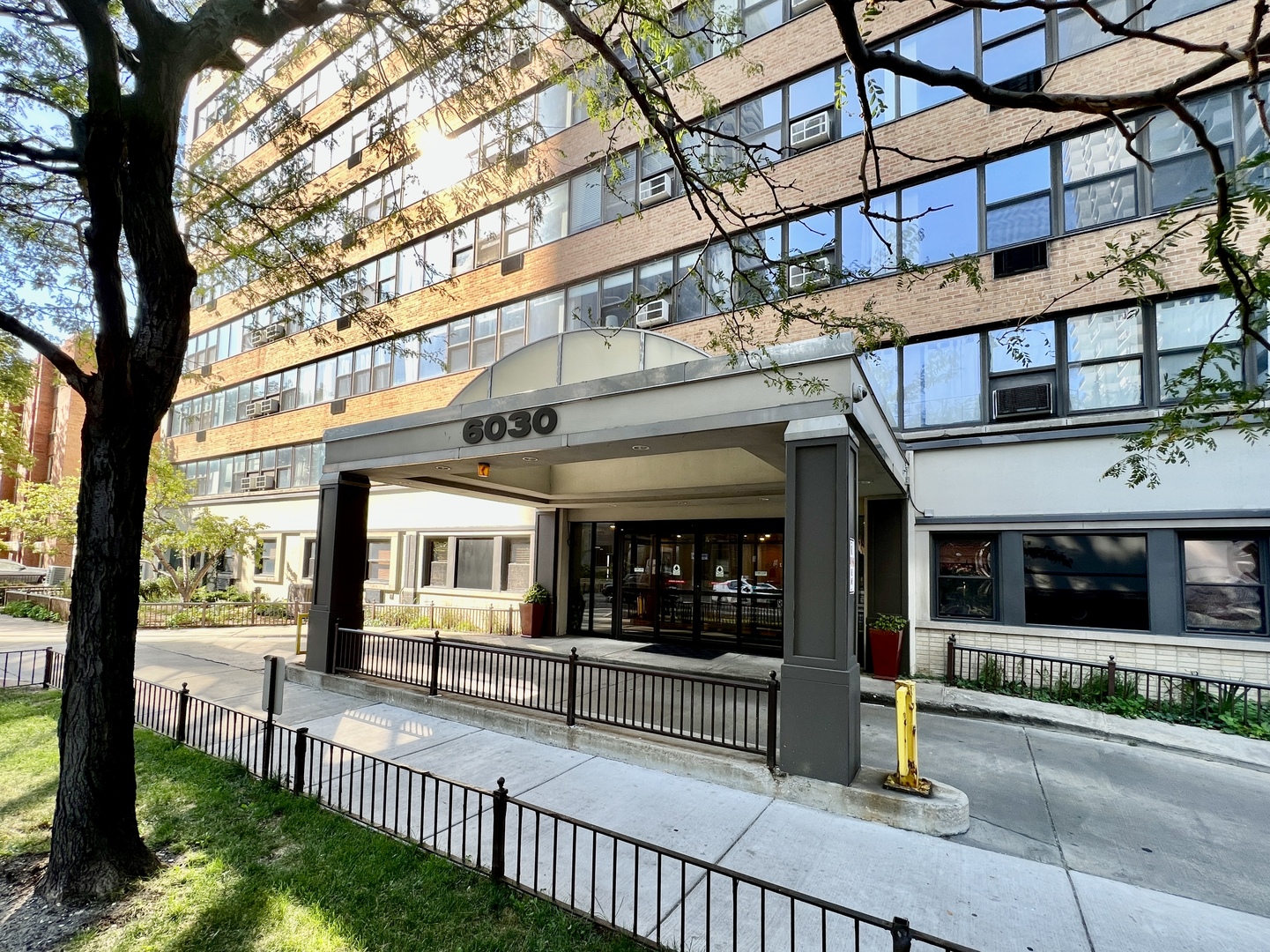 6030 North Sheridan Road, Unit 2109 Chicago, IL 60660 - Photo 2 of 11 a view of a building with a tree