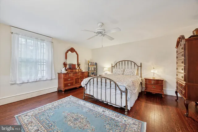 a bedroom with furniture and a window