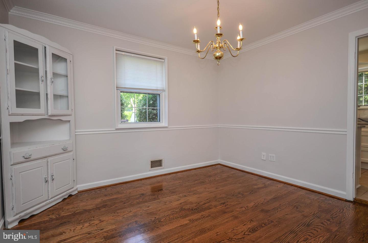 2315 Plyers Mill Road Silver Spring, MD 20902 - Photo 11 of 28 wooden floor in an empty room with a window