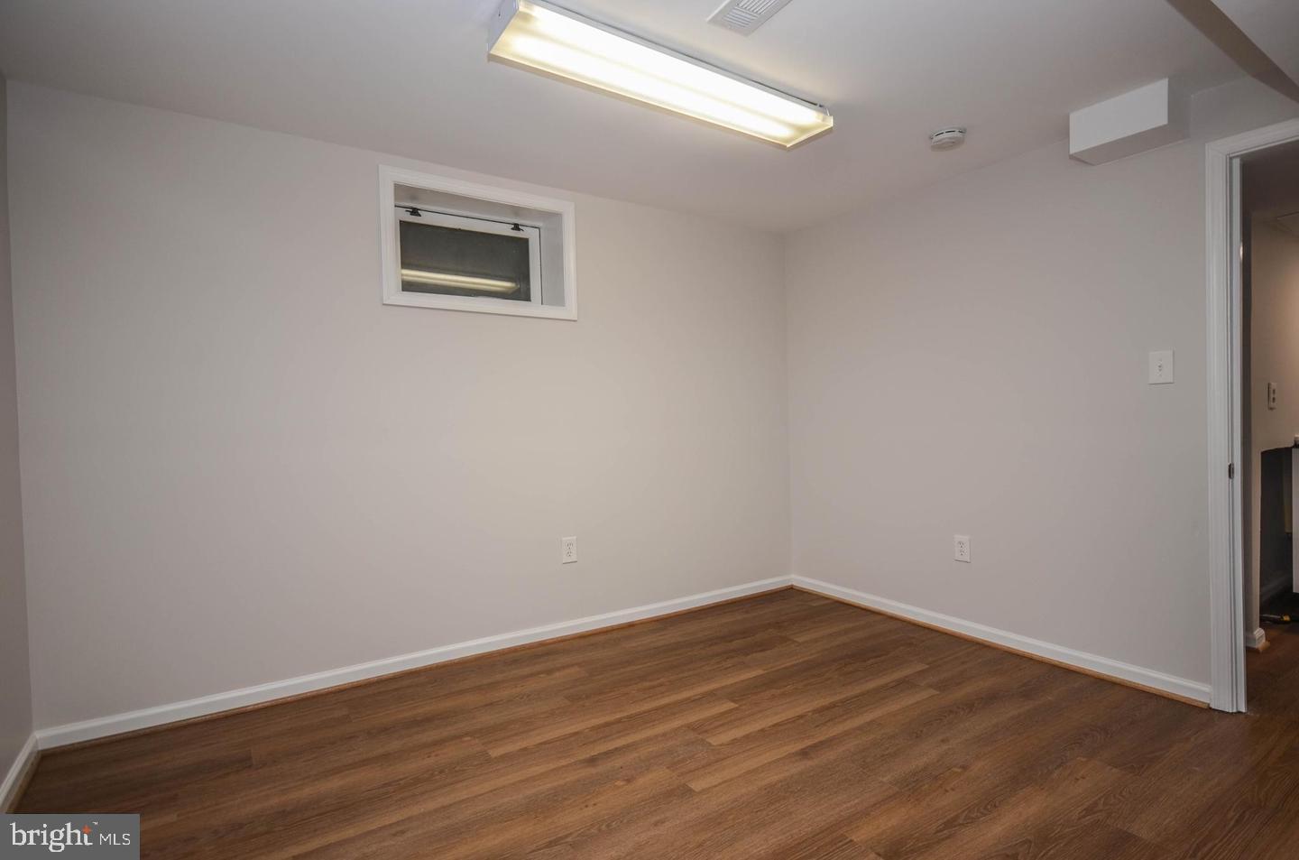 2315 Plyers Mill Road Silver Spring, MD 20902 - Photo 19 of 28 a view of a room with wooden floor and window