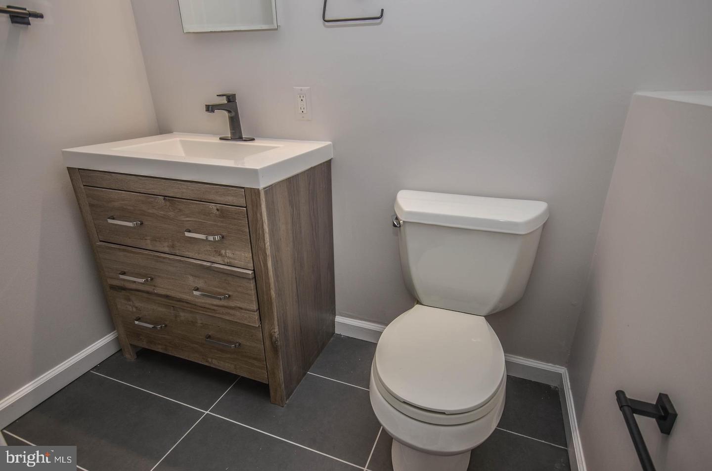 2315 Plyers Mill Road Silver Spring, MD 20902 - Photo 24 of 28 a bathroom with a toilet and a sink