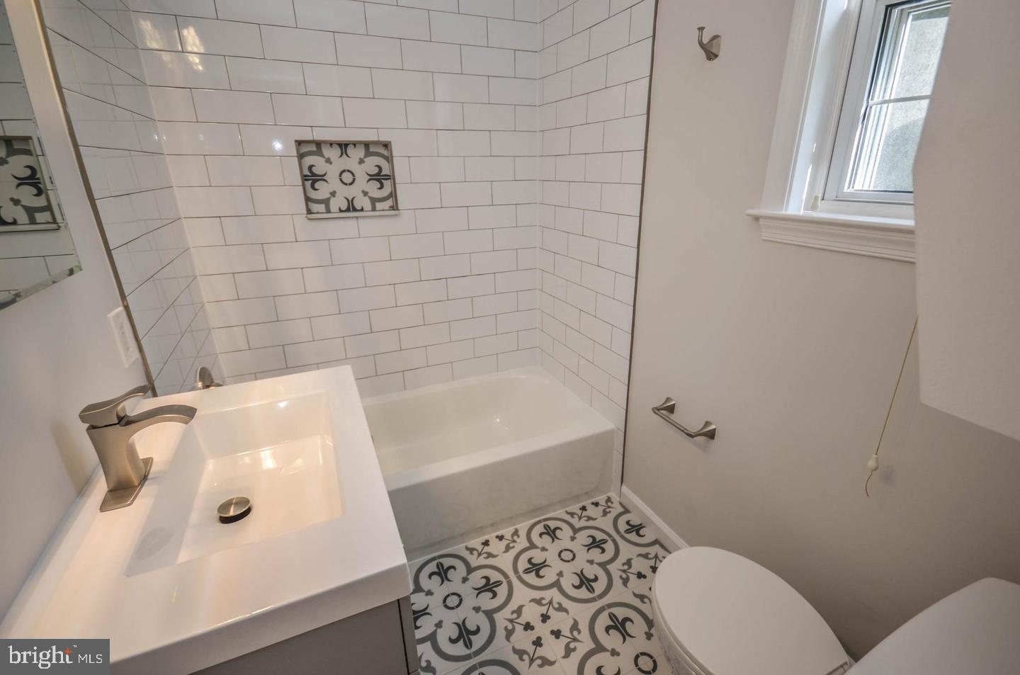 2315 Plyers Mill Road Silver Spring, MD 20902 - Photo 9 of 28 a bathroom with a bathtub and shower