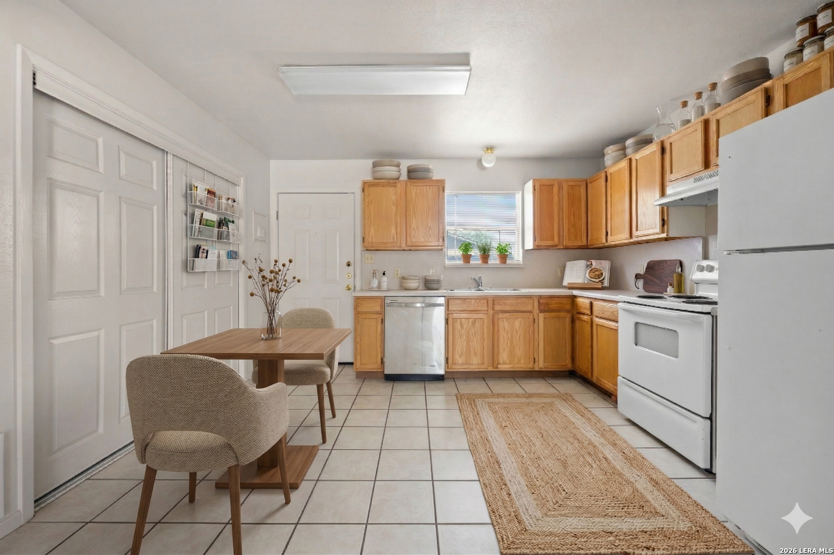 1118 West Goodwin Street Pleasanton, TX 78064 - Photo 12 of 23 a kitchen with a cabinets a sink and a counter top space