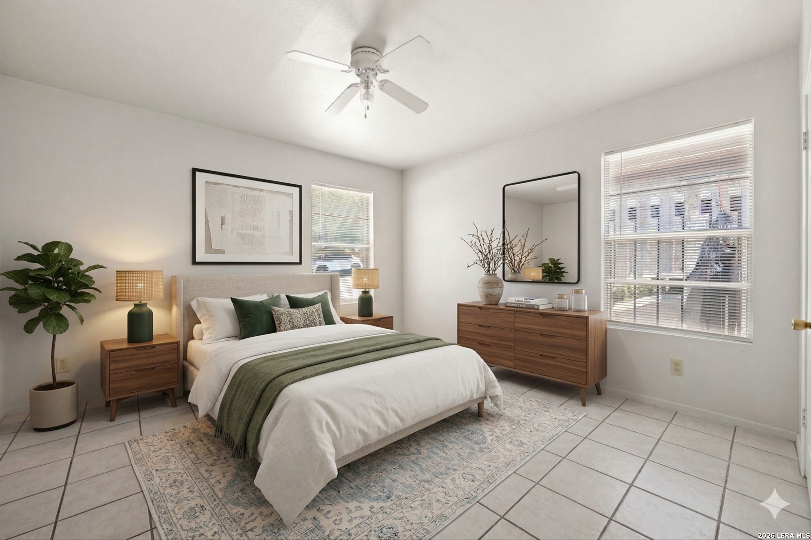 1118 West Goodwin Street Pleasanton, TX 78064 - Photo 14 of 23 a bedroom with a large bed and a potted plant