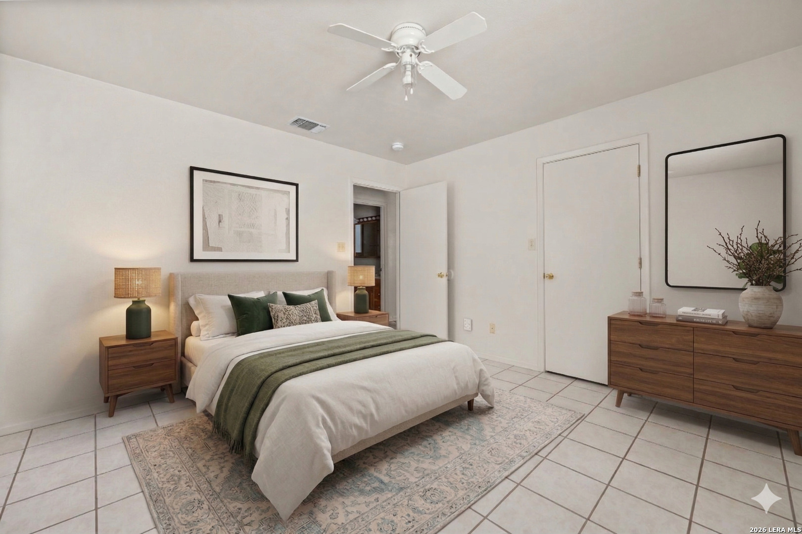 1118 West Goodwin Street Pleasanton, TX 78064 - Photo 15 of 23 a spacious bedroom with a bed and a chandelier