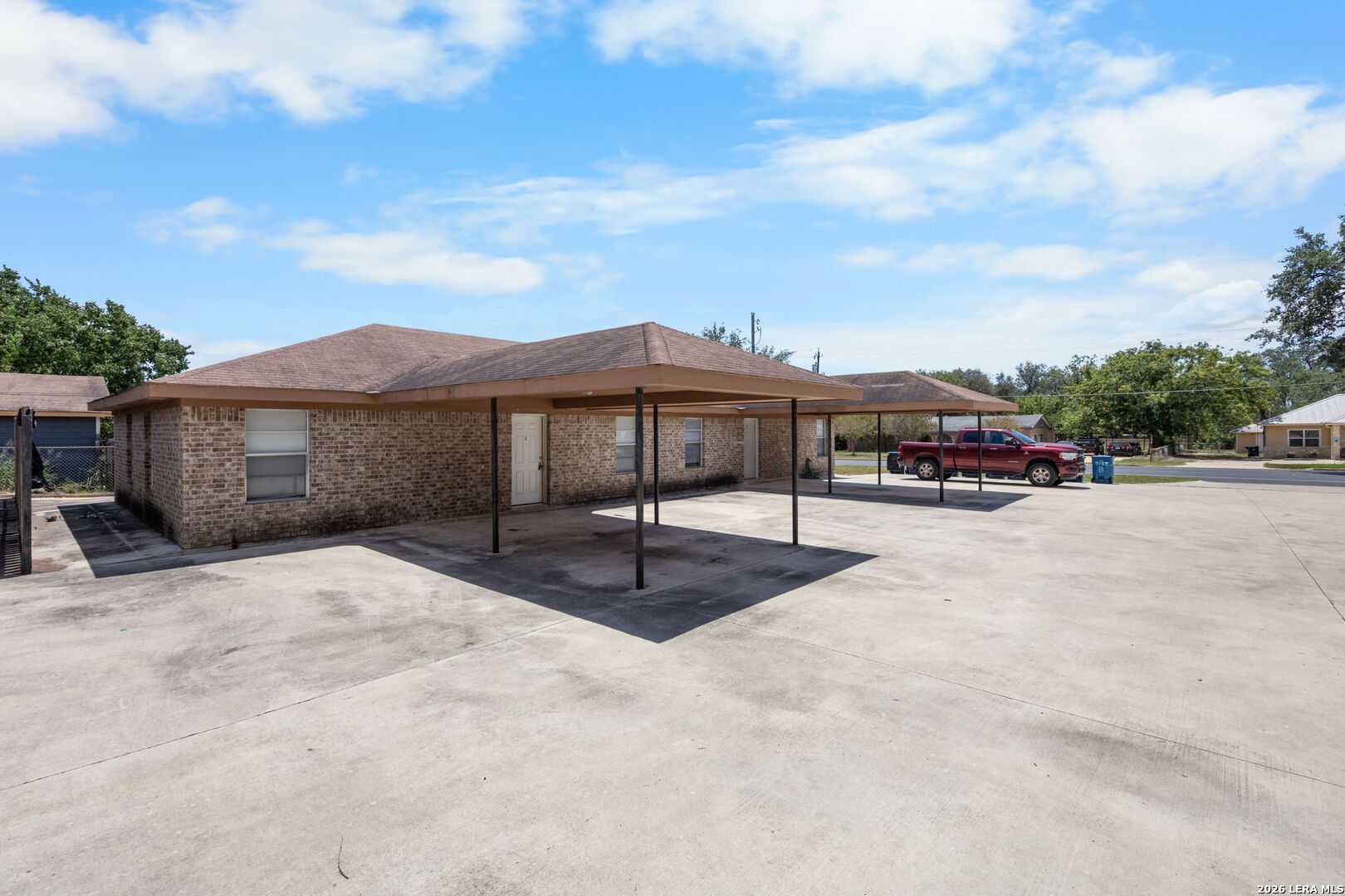 1118 West Goodwin Street Pleasanton, TX 78064 - Photo 18 of 23 a view of a house with a yard and sitting area