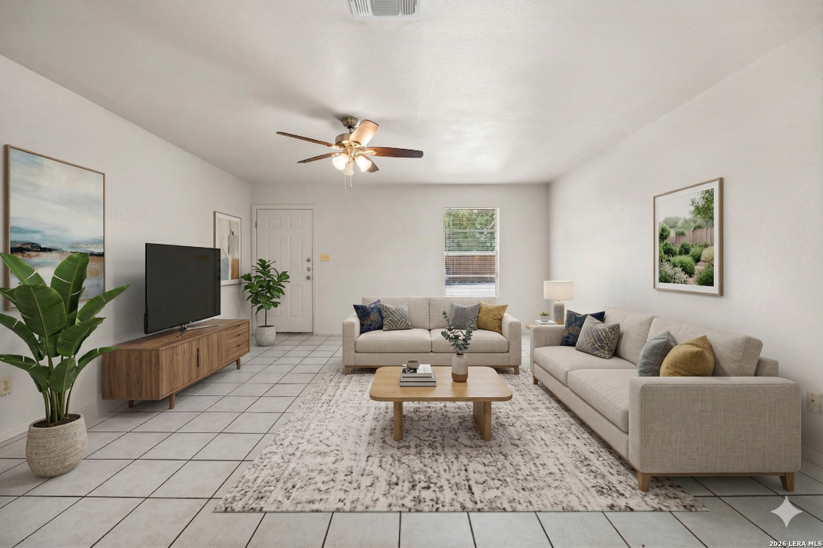 1118 West Goodwin Street Pleasanton, TX 78064 - Photo 3 of 23 a living room with furniture and a flat screen tv