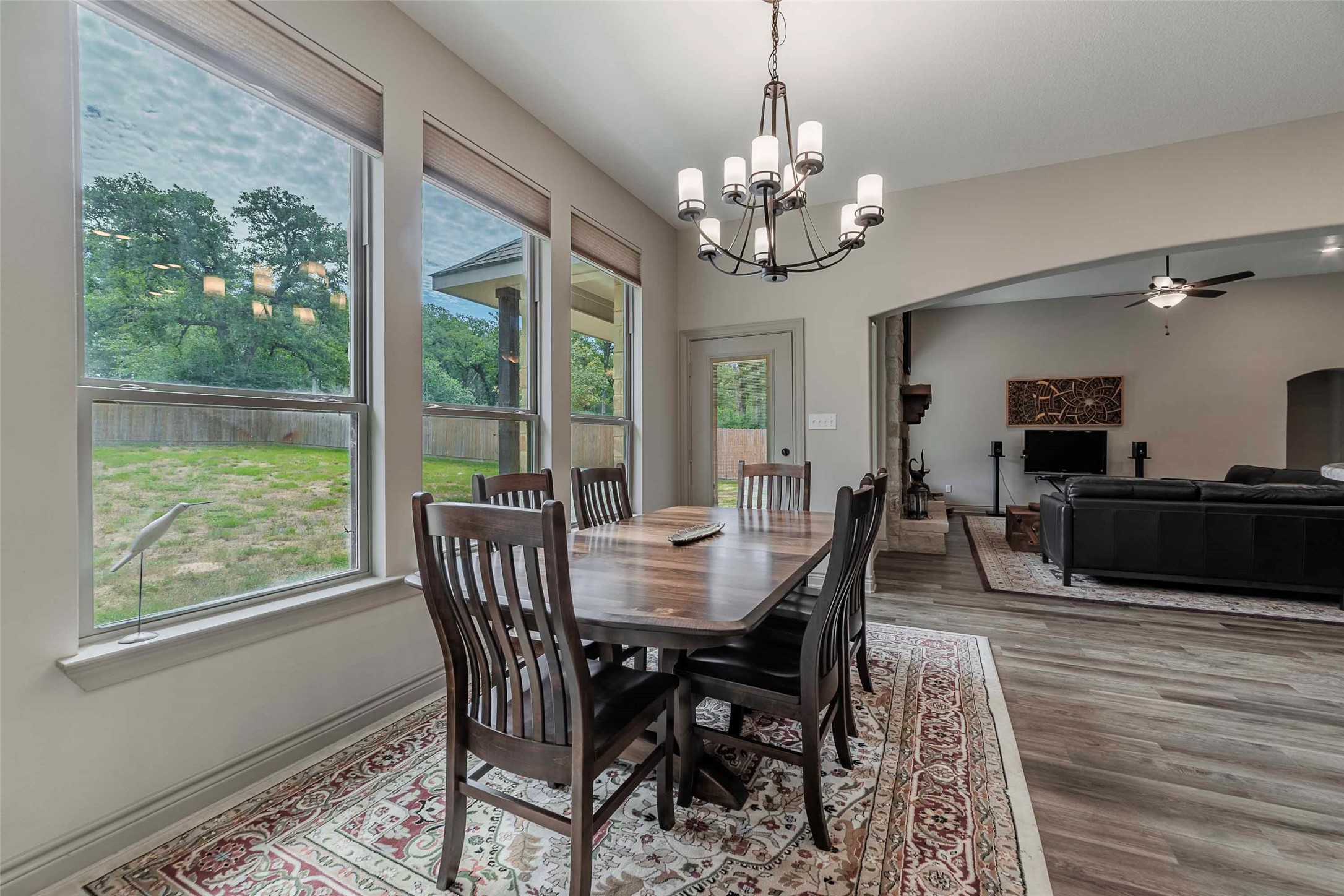 9695 County Road 321 Caldwell, TX 77836 - Photo 12 of 40 a view of a dining room with furniture a chandelier and wooden floor