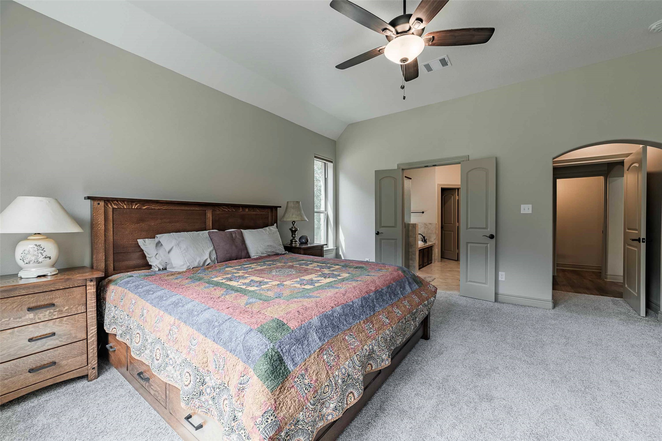 9695 County Road 321 Caldwell, TX 77836 - Photo 13 of 40 a bedroom with bed and a chandelier