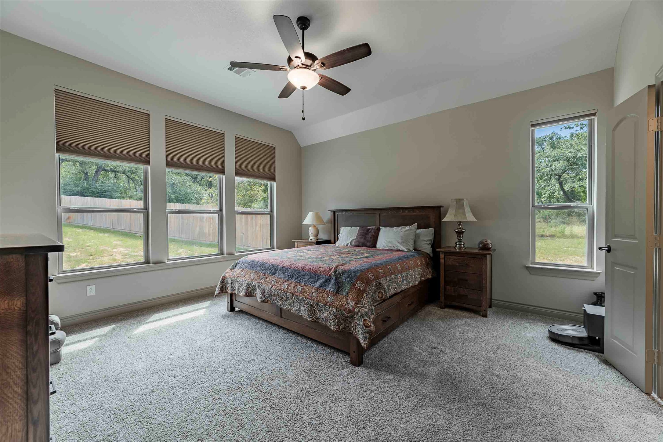 9695 County Road 321 Caldwell, TX 77836 - Photo 17 of 40 a spacious bedroom with a large bed and a large window
