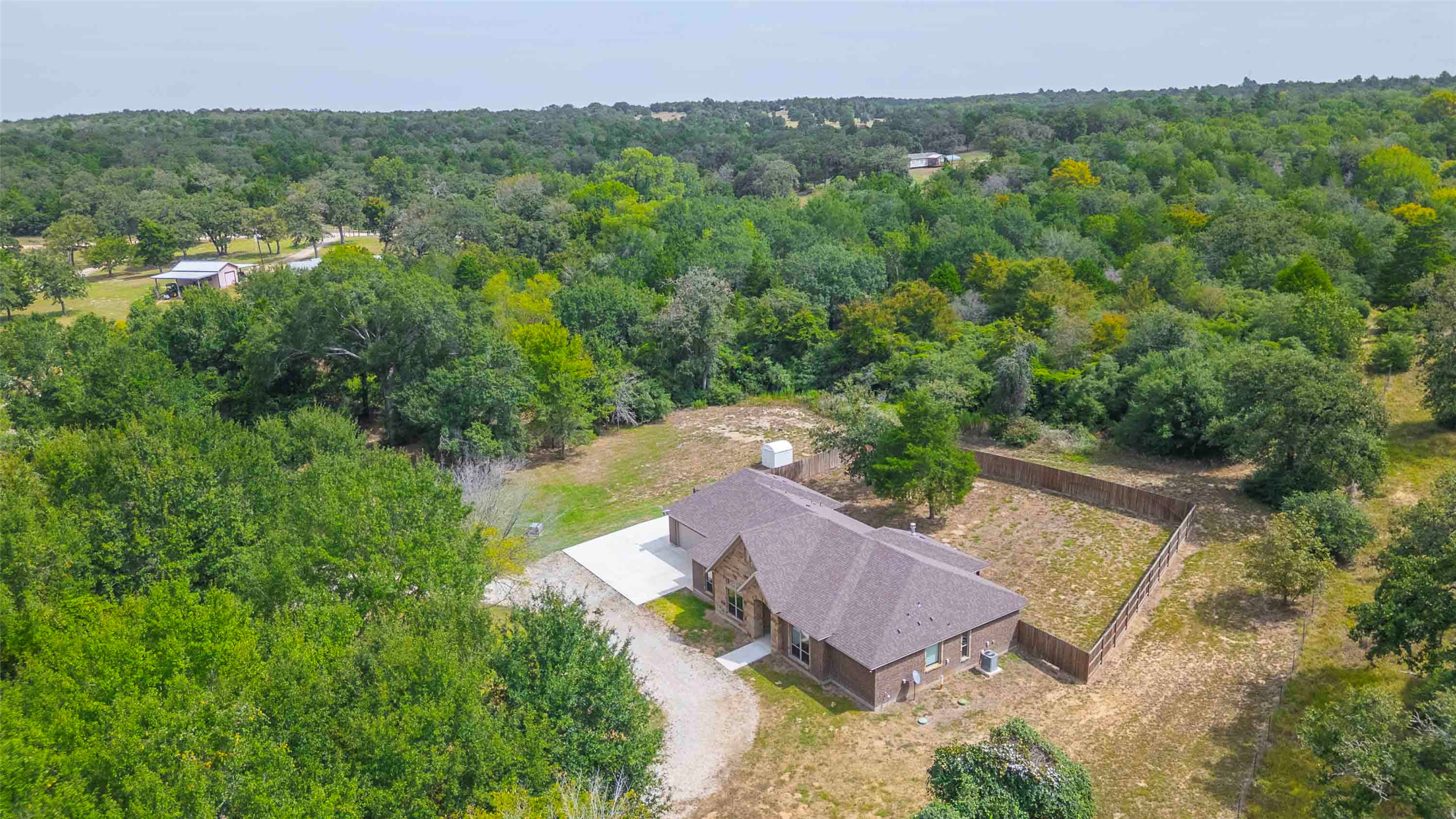 9695 County Road 321 Caldwell, TX 77836 - Photo 2 of 40 an aerial view of a house with a yard